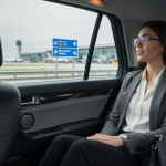 Female Business traveler taking an Uber from Manchester airport to Manchester city centre with a portable wifi in her bag | Airport Wifi Hire | Airport Wifi Hire Female Business traveler taking an Uber from Manchester airport to Manchester city centre with a portable wifi in her bag
